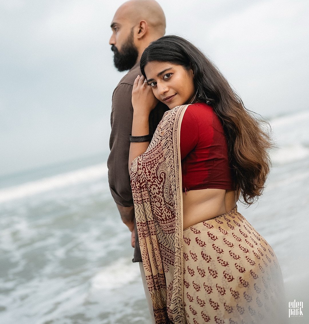 A couple embracing by the sea